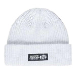 Beyond Medals Culture Beanie 2024 - A white beanie with a black rectangular patch on the front featuring illegible white text and logos.