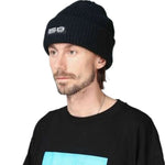 Beyond Medals Culture Beanie 2024 - A black beanie with a white logo on the front.