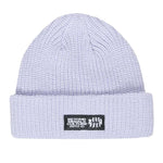 Beyond Medals Culture Beanie 2024 - A light gray beanie with a black patch featuring white text and logo.