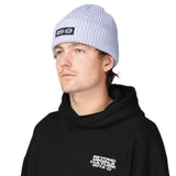 Beyond Medals Culture Beanie 2024 - A light gray beanie with a black rectangular patch on the front featuring white text that reads "BEYOND MEDALS CULTURE".