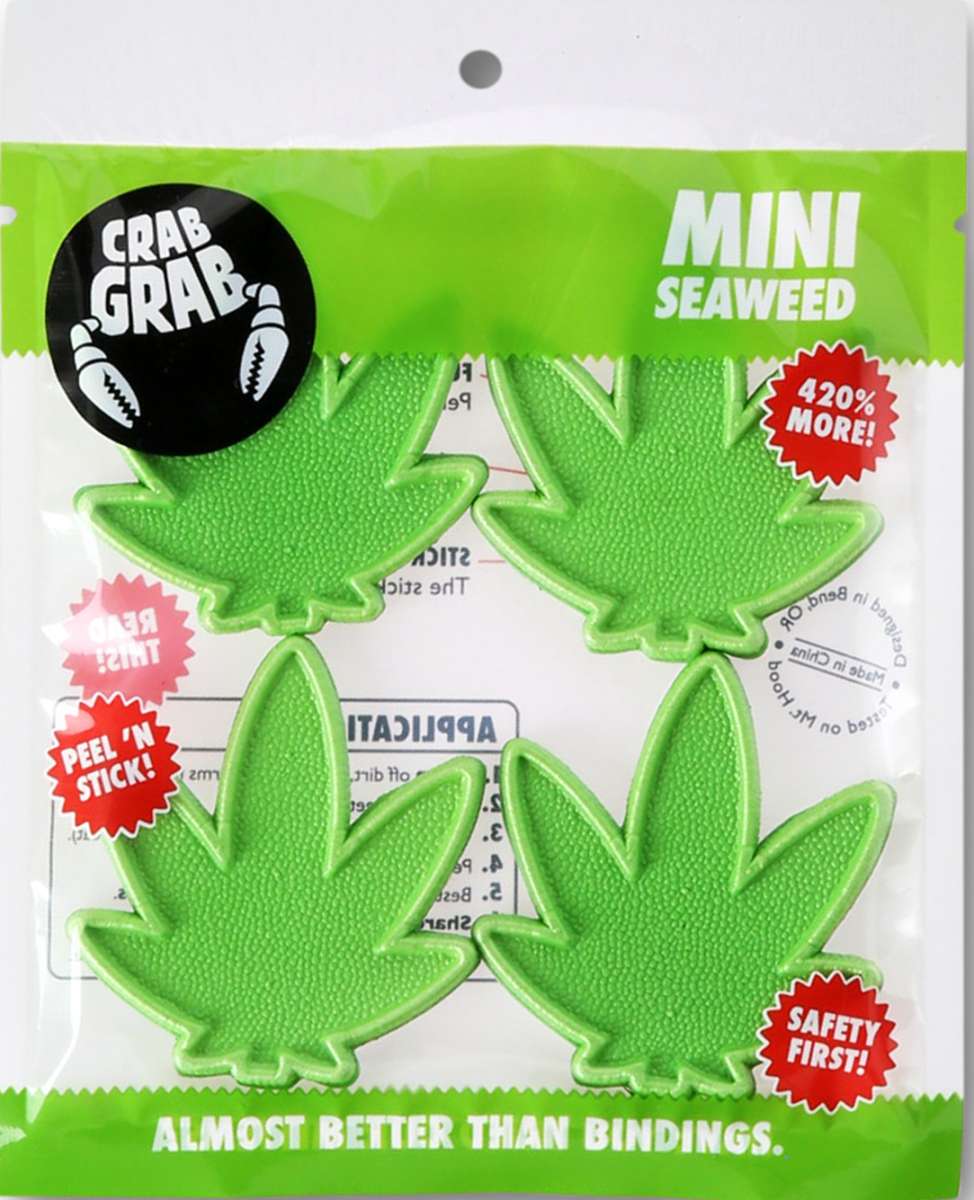 Crab Grab Mini Seaweed Stomp Pad 2023 - Green seaweed-shaped pad with a textured surface and three small suction cups on the bottom.