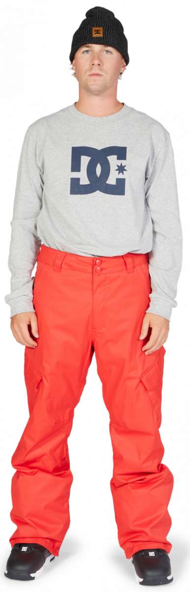 DC Banshee Insulated Pant 2023 - A pair of snow pants with a black and white logo on the left thigh, featuring a zippered pocket and adjustable Velcro straps at the waist.