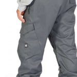 DC Banshee Insulated Pant 2023 - A pair of gray snowboard pants with a zippered pocket on the thigh and a small white logo near the bottom left leg.