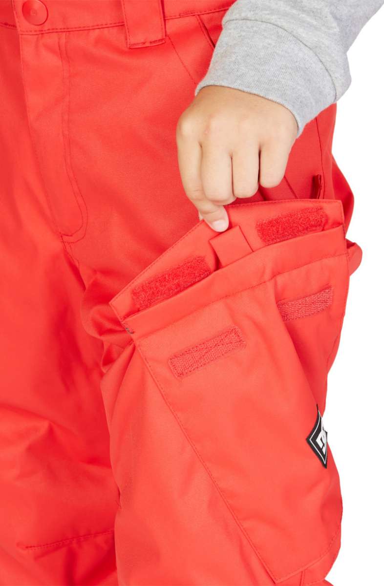 DC Junior's Banshee Insulated Pant - A pair of red snow pants with a black and white logo on the left leg.