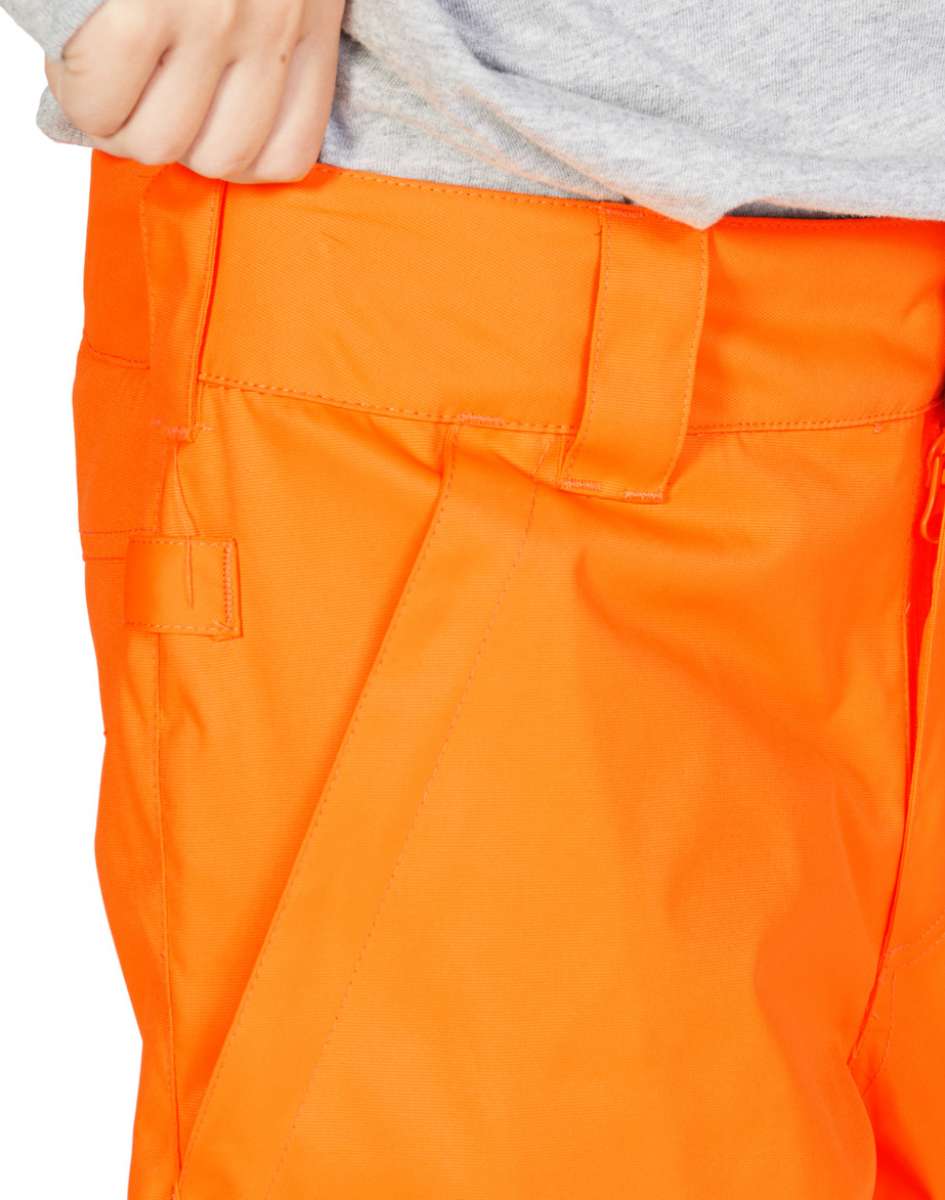 DC Junior's Banshee Insulated Pant 2023 - A pair of bright orange snow pants with a black stripe down the side and a zippered pocket on the thigh.
