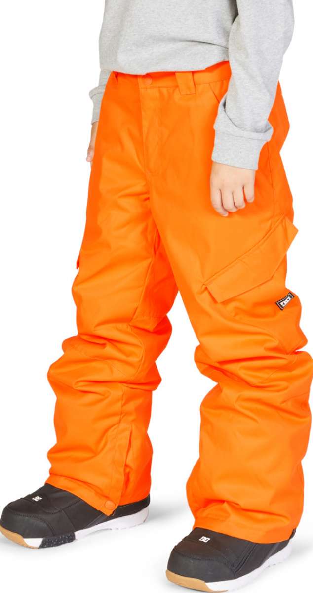 DC Junior's Banshee Insulated Pant 2023 - Bright orange snow pants with zippered pockets and adjustable cuffs.