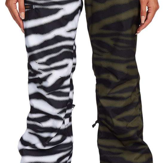 DC Women's Viva Shell Pant 2022 - Black pants with a subtle white pattern of diagonal stripes and a small, repeating logo on the left thigh.