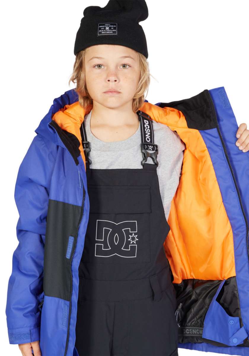 DC Junior's Defy Insulated Jacket - A blue jacket with a black zipper and white logo on the chest.