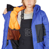 DC Junior's Defy Insulated Jacket - A royal blue jacket with a black zipper and white logo on the chest.