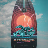 Hyperlite Time Machine Limited Edition Wakesurf Board 2022 - A black wakesurf board with a neon blue and pink design featuring a DeLorean car, set against a red circle background.
