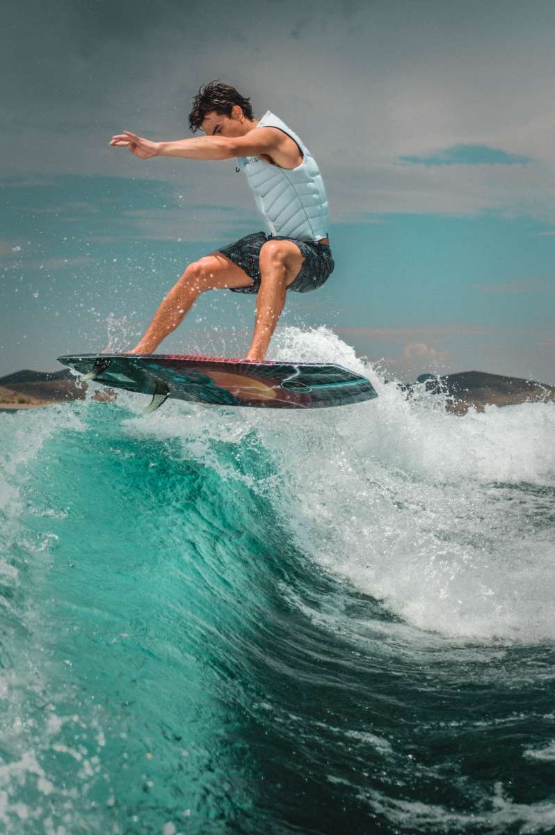 Hyperlite Time Machine Limited Edition Wakesurf Board 2022 - A blue and black board with a white logo on top, featuring a distinctive design.