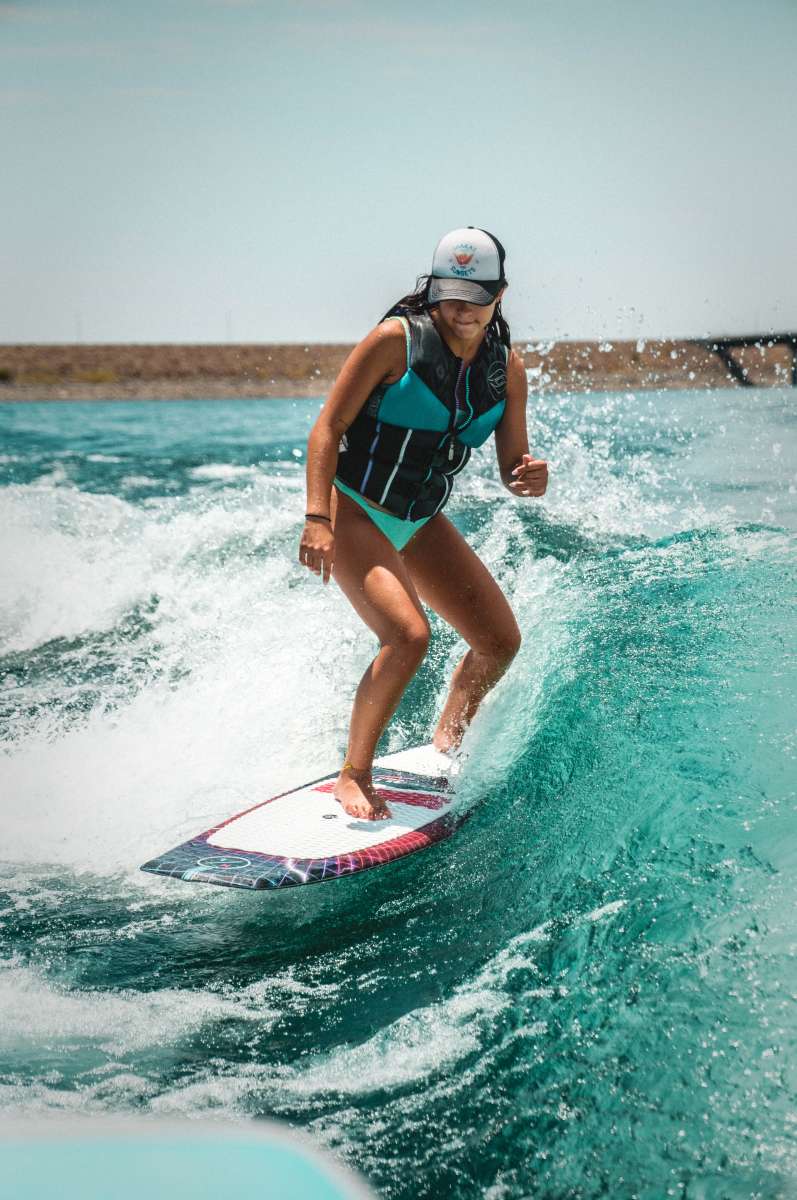 Hyperlite Time Machine Limited Edition Wakesurf Board 2022 - A blue and white wakesurf board with a distinctive red logo on top.