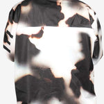 Endeavor 3L Shelter Shell Jacket 2024 - A black and white jacket with a subtle pattern of abstract shapes, featuring a hood and zippered pockets.