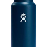 Hydro Flask - A dark blue water bottle with a black lid, featuring a wide mouth opening and a handle on top.