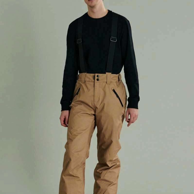 Liquid Cave Insulated Suspender Pant - Black insulated snow pants with adjustable suspenders and zippered pockets.