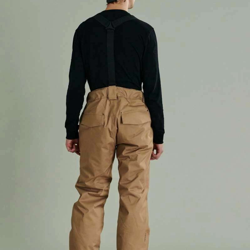Liquid Cave Insulated Suspender Pant - Black insulated snow pants with adjustable suspenders and zippered pockets.