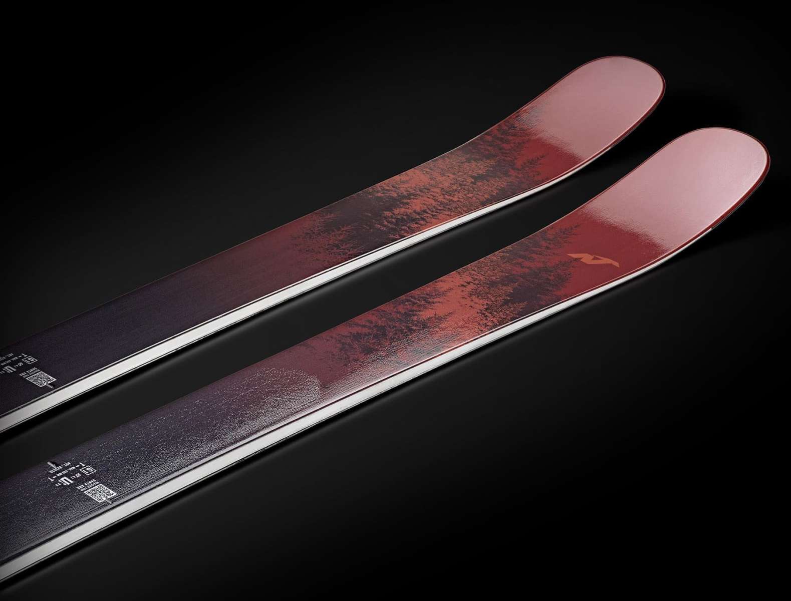 Nordica Ladies Santa Ana 88 Unlimited - A pair of skis with a dark red base color and black trees printed on them.
