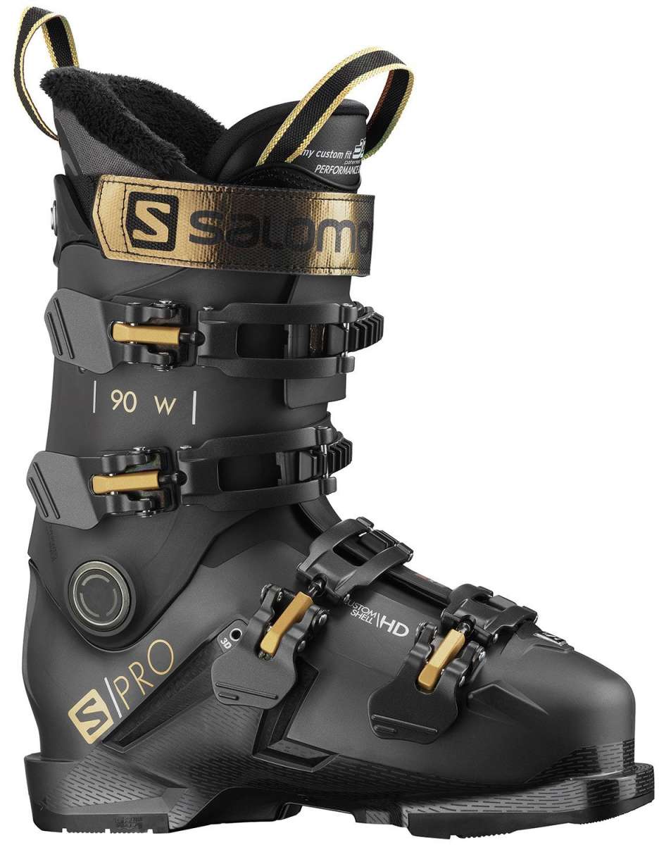 Salomon Ladies S-Pro 90 GW Ski Boots 2022 - Black ski boots with gold buckles and a black strap.