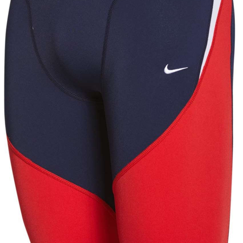 Nike Swim Men's Poly Color Surge Jammer Swimsuit - A navy blue and red swimsuit with a white Nike logo on the left leg.