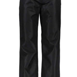 Obermeyer Keystone Shell Pant Short 2022 - Black pants with a subtle snowflake pattern on the left thigh.