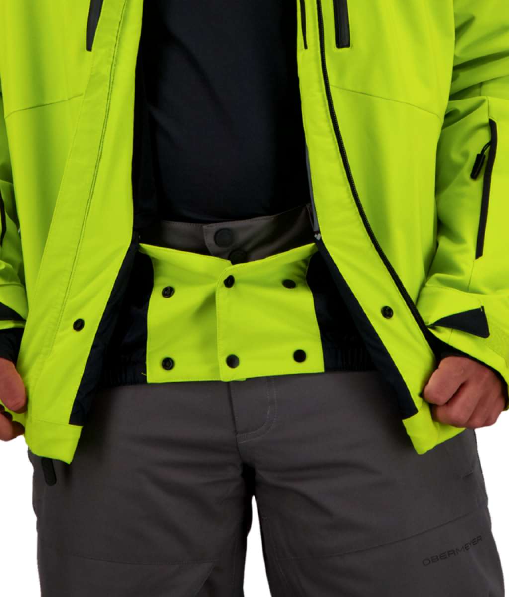 Obermeyer Raze Insulated Jacket 2022 - A bright yellow jacket with black accents and a high collar, featuring two zippered pockets on either side.