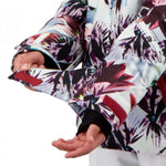 Obermeyer Girls Taja Print Insulated Jacket 2022 - A white jacket with a colorful floral pattern featuring pink, purple, and green flowers.