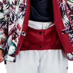 Obermeyer Girls Taja Print Insulated Jacket 2022 - A white jacket with a colorful floral pattern and black buttons down the front.