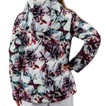 Obermeyer Girls Taja Print Insulated Jacket 2022 - A white jacket with a colorful, abstract floral pattern featuring pink, purple, and green leaves on a black background.