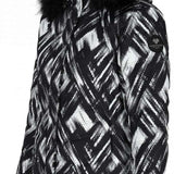 Obermeyer Women's Tuscany II Down Jacket 2024 - A black and white down jacket with a geometric pattern, featuring a fur-lined hood.