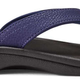 Olukai Women's Ohana Sandals - A pair of navy blue sandals with a strap and toe post, featuring a textured pattern on the straps.