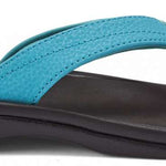 Olukai Women's Ohana Sandals 2022 - A pair of women's sandals with a strap and toe post, featuring a light-colored sole and a darker strap.