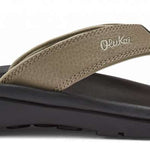Olukai Ohana Sandals 2022 - A pair of brown sandals with a strap and toe post, featuring a logo on the side.