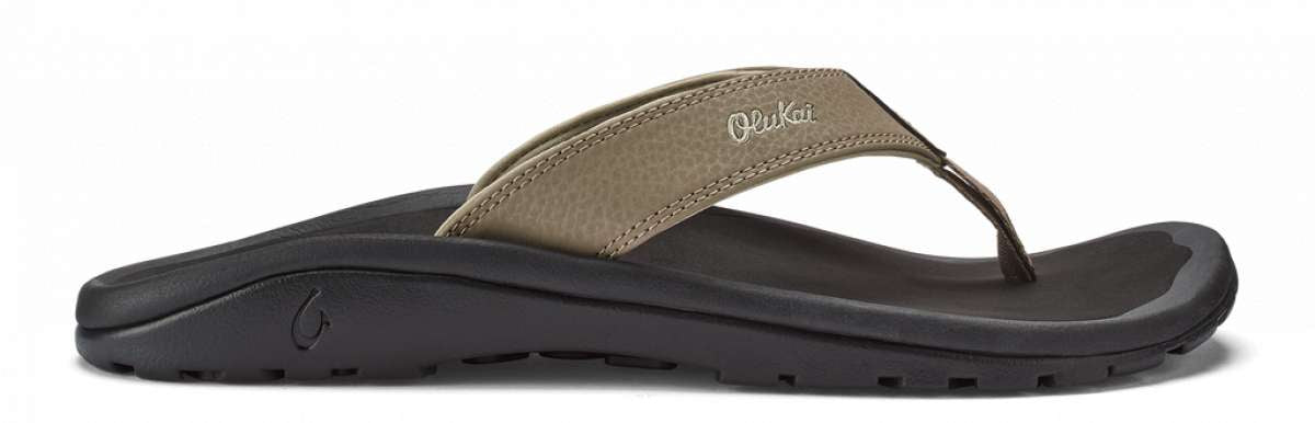 Olukai Ohana Sandals 2022 - A pair of brown sandals with a strap and toe post, featuring a logo on the side.