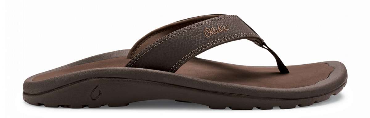 Olukai Ohana Sandals - A pair of brown sandals with a strap and toe post, featuring a logo on the side.