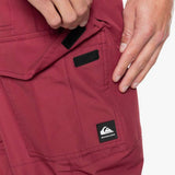 Quiksilver Porter Insulated Pants 2022 - A pair of red insulated pants with a black label featuring the Quicksilver logo and brand name.
