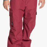 Quiksilver Porter Insulated Pants - A pair of red insulated pants with a black zipper on the left leg pocket.