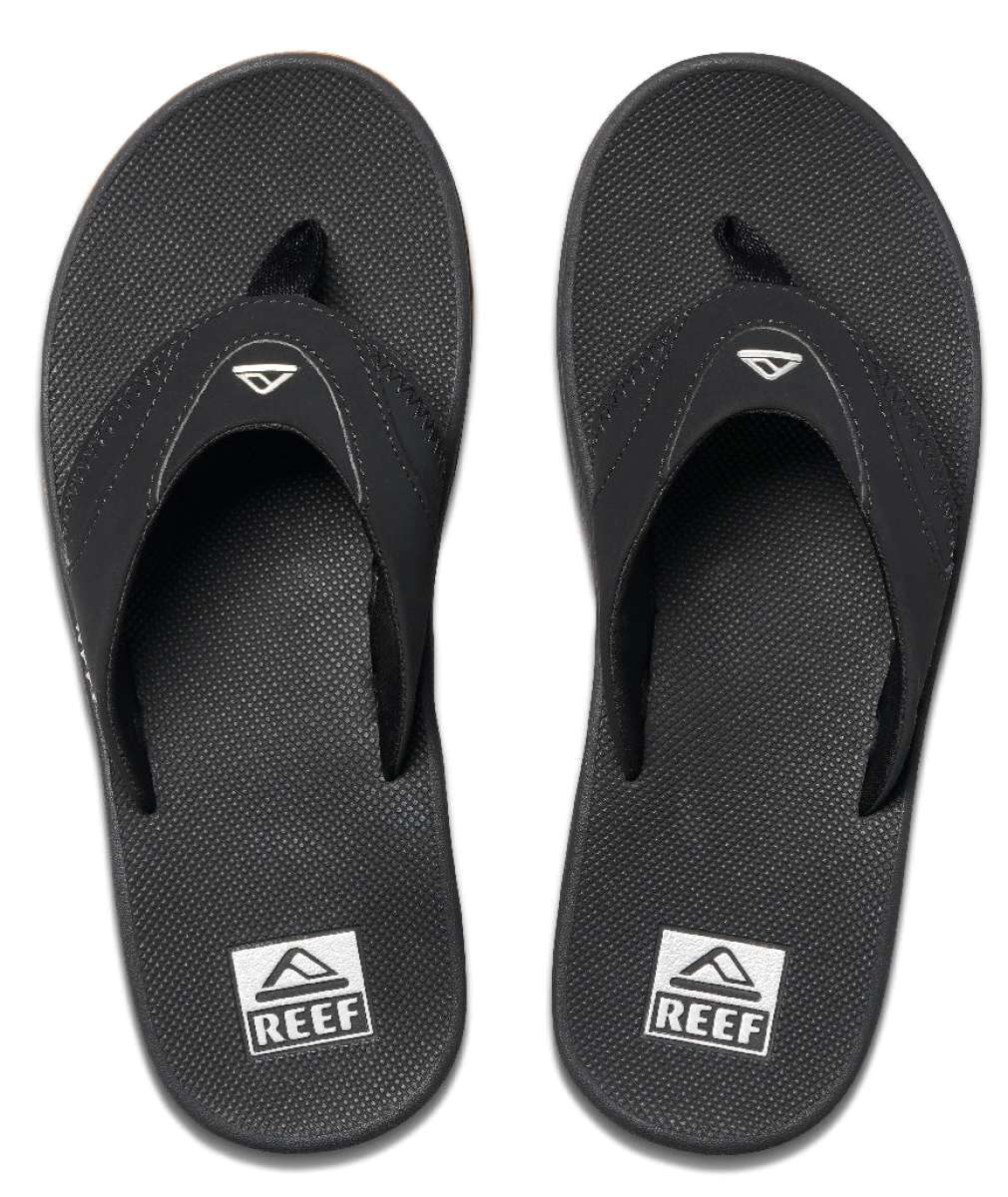 Reef Men's Fanning Sandal - A pair of black sandals with a white logo on top, featuring a strap and toe post.