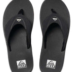 Reef Men's Fanning Sandal - A pair of black sandals with a white logo on top, featuring a strap and toe post.
