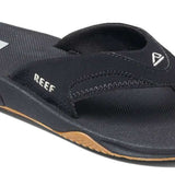 Reef Men's Fanning Sandal - A black sandal with a white logo on top of the footbed, featuring a strap that goes between the big and second toe.