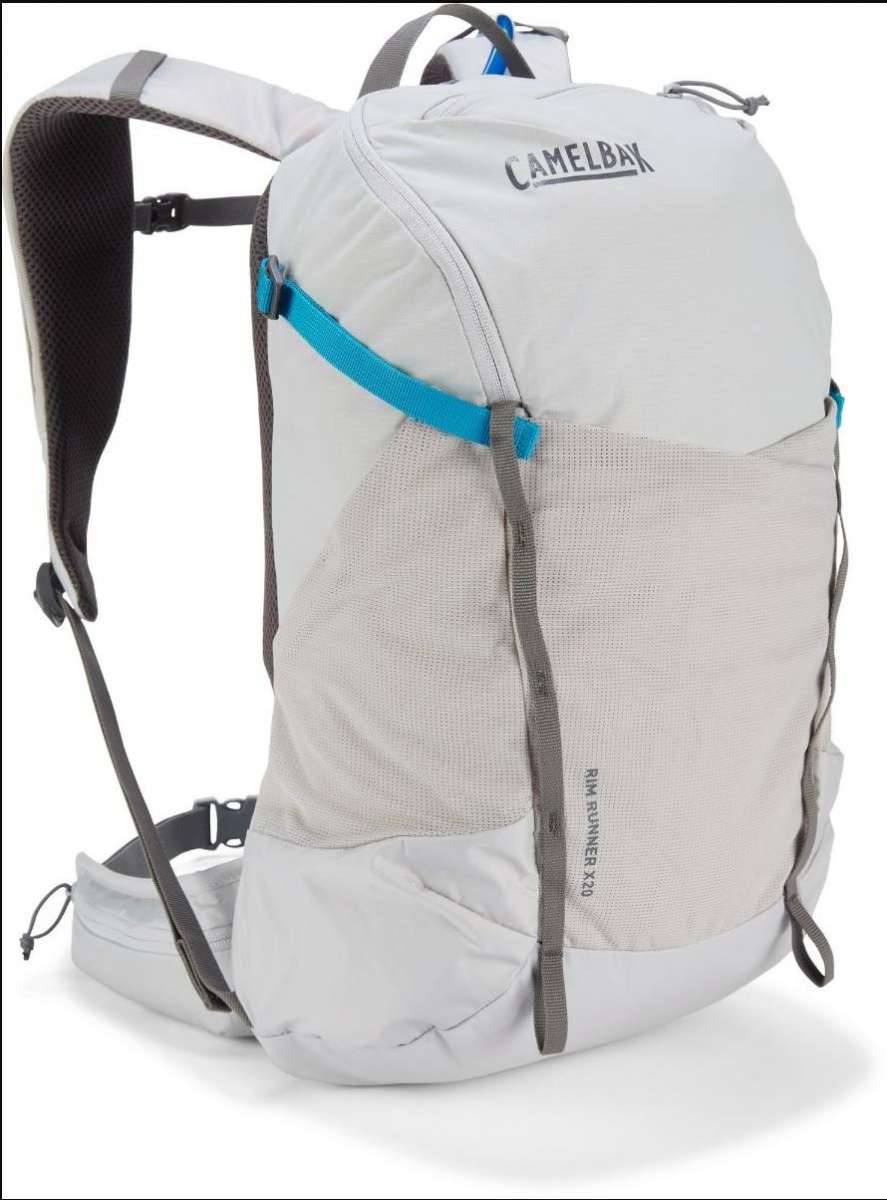 CamelBak - A white backpack with a blue zipper and gray straps.