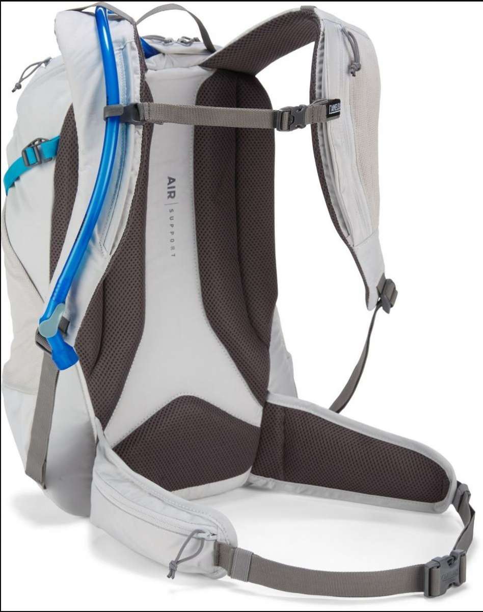 CamelBak Ladies Rim Runner X20 70oz Pack - A white backpack with a blue water hose and black straps.
