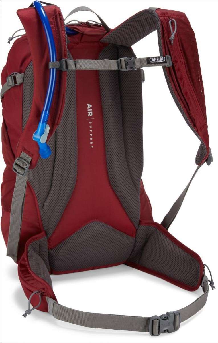 CamelBak Ladies Rim Runner X20 70oz Pack 2022-2023 - A maroon-colored hydration pack with a blue drinking tube and white lettering.