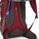 CamelBak Ladies Rim Runner X20 70oz Pack 2022-2023 - A maroon-colored hydration pack with a blue drinking tube and white lettering.