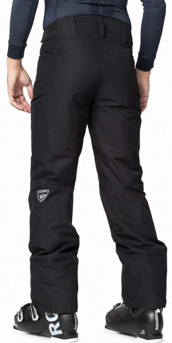 Rossignol Rapide Insulated Pant 2022-2023 - Black insulated ski pants with a white logo on the left leg and silver hardware.