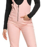 Roxy Women's Summit Bib Shell Pant 2023 - A pair of light pink snow pants with a black zipper and white trim on the side pockets.