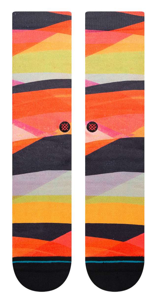 Stance Abstruse Crew Socks 2023 - A pair of crew socks in a vibrant, abstract pattern featuring shades of orange, yellow, pink, and black.