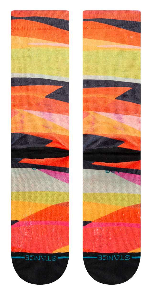 Stance Abstruse Crew Socks 2023 - A pair of crew socks in a vibrant, abstract design featuring shades of orange, yellow, pink and black.