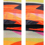 Stance Abstruse Crew Socks 2023 - A pair of crew socks in a vibrant, abstract design featuring shades of orange, yellow, pink and black.