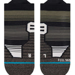 Stance Caliber Tab Low Cut Socks 2023 - Black socks with white stripes and a small logo on the top.