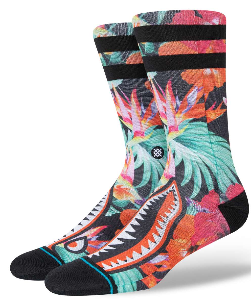 Stance Dorian Crew Cut Socks 2023 - A pair of crew socks with a tropical floral pattern in shades of pink, orange, and green on a black background.